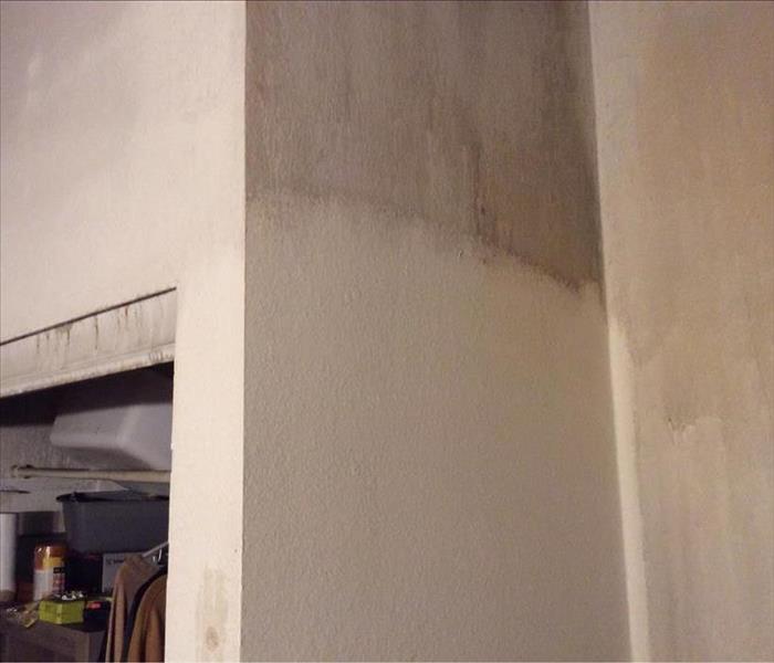 wall with smoke and soot partly removed