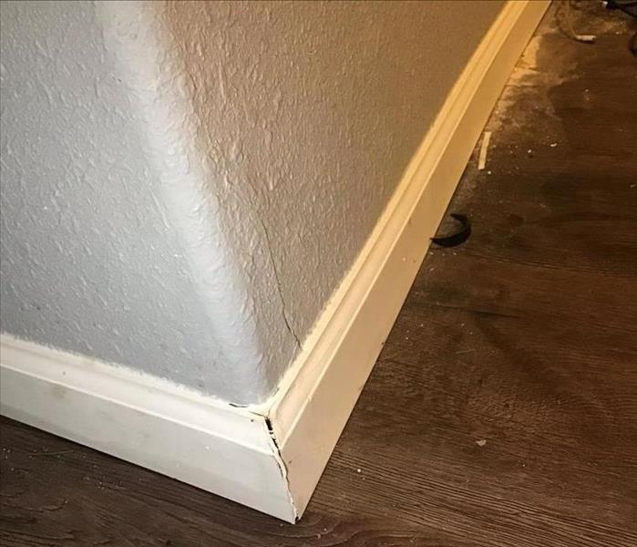 A corner of a room with water damage
