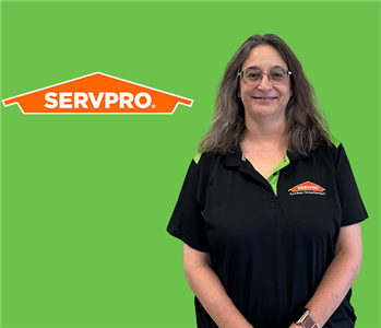 woman in front of servpro logo