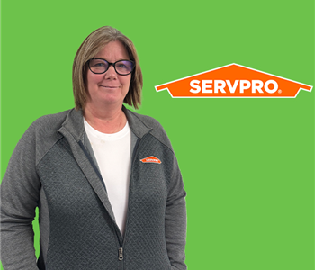 woman in front of servpro logo