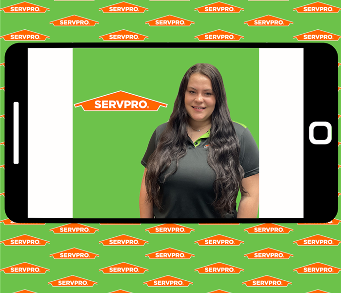 Marketing Support Coordinator in front of SERVPRO Green and Logo